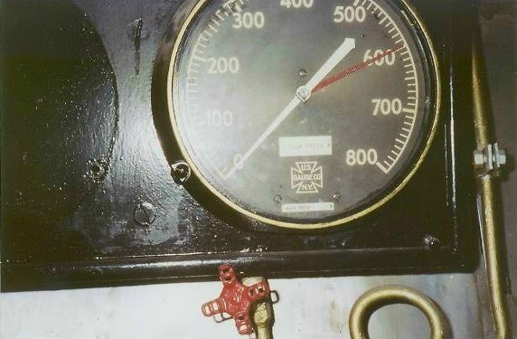 Large main steam pressure gauge scaled 0 to 800 psi reading about 550 to 600 psi