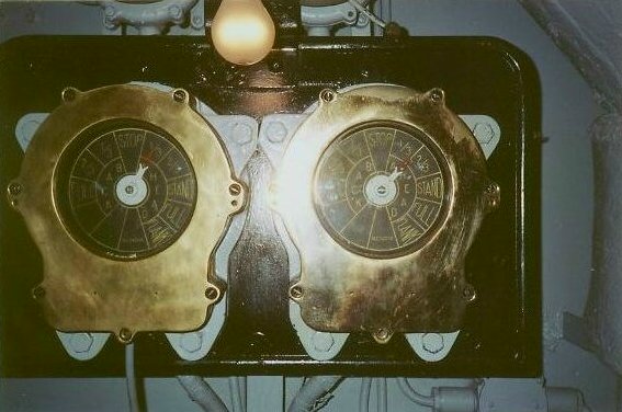 Pair of engine order telegraph indicator repeaters showing ahead, astern, stop and standby