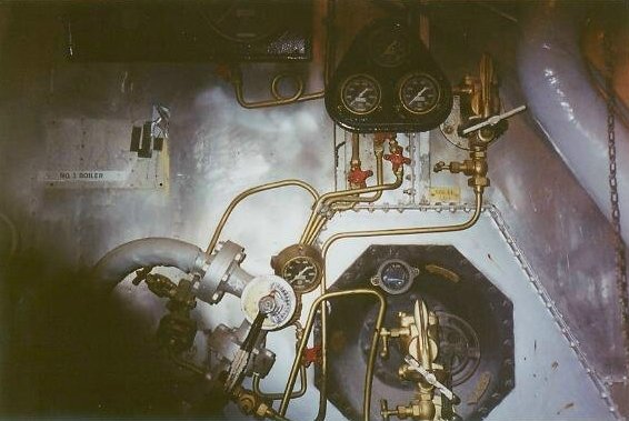 Wider boiler front view showing top burner on saturated side and higher exposing another burner used for creating a smoke screen