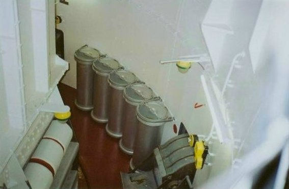 Turret foundation and stalk that hangs from the turret and rotates with it. Three powder bags visible.