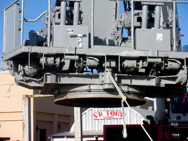 20,000-pound Bofors quad mount being lifted by crane at Pearl Harbor