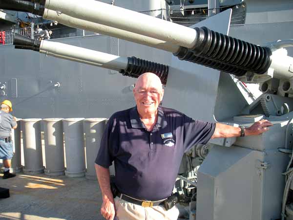 Ford Murray posing next to the Bofors at Pearl Harbor