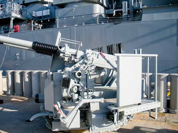 Bofors quad mount on the dock at Pearl Harbor waiting to be hoisted aboard the USS Missouri