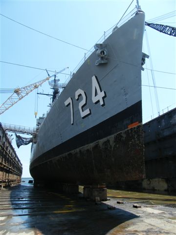USS Laffey DD-724 in drydock — port side amidships showing the destroyer's keel and hull frames exposed during the major preservation overhaul