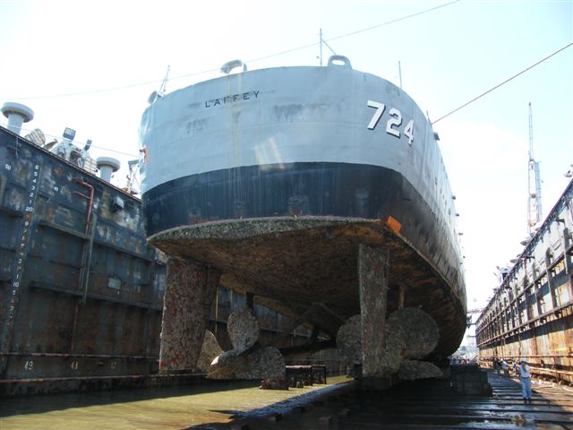 USS Laffey DD-724 drydock — stern view in AFDL-47 floating drydock with the ship's propellers and rudder visible above the drydock floor
