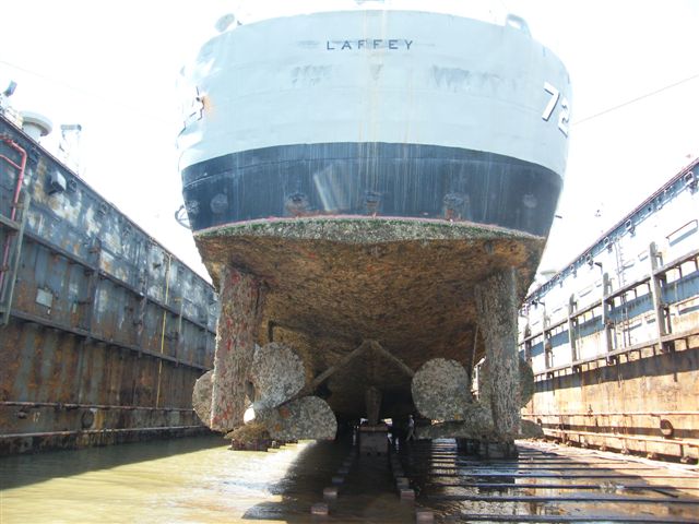 USS Laffey DD-724 drydock — overhead view looking down the main deck from amidships toward the bow while the ship rests in the floating drydock