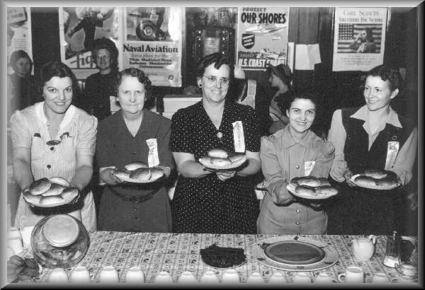 North Platte Canteen officers displaying ham sandwiches, 1943