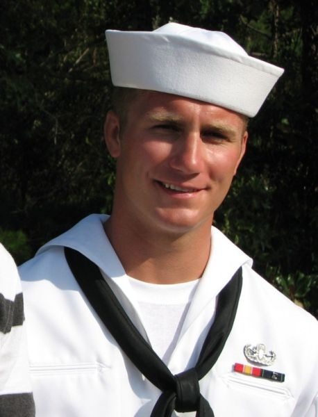 Taylor Morris in Navy dress whites, wearing the explosive ordnance disposal badge and his service ribbons