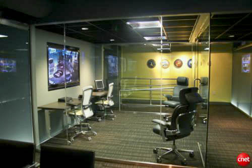 Glass-walled private room inside the Command Center of the Future, designed to go dark and become soundproof for classified discussions