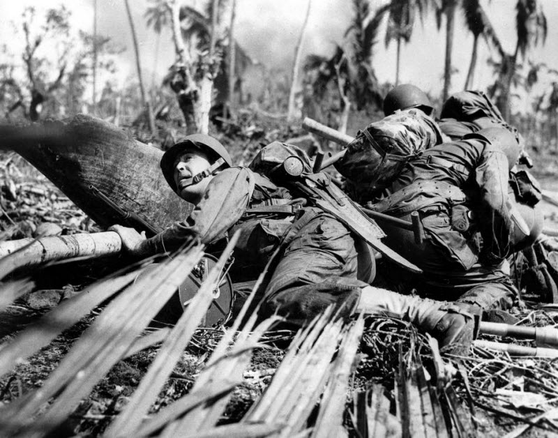 American soldiers take cover from Japanese machine gun fire in Philippines November 1944